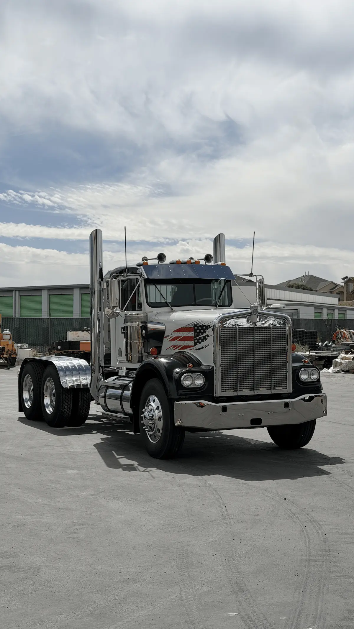 Polished classic Kenworth semi truck outdoors